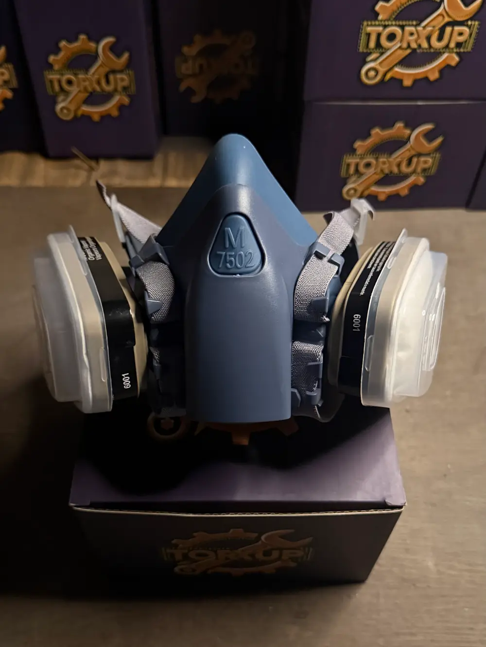 Torxup CoreMask front-on on its box, stacked Torxup boxes behind.