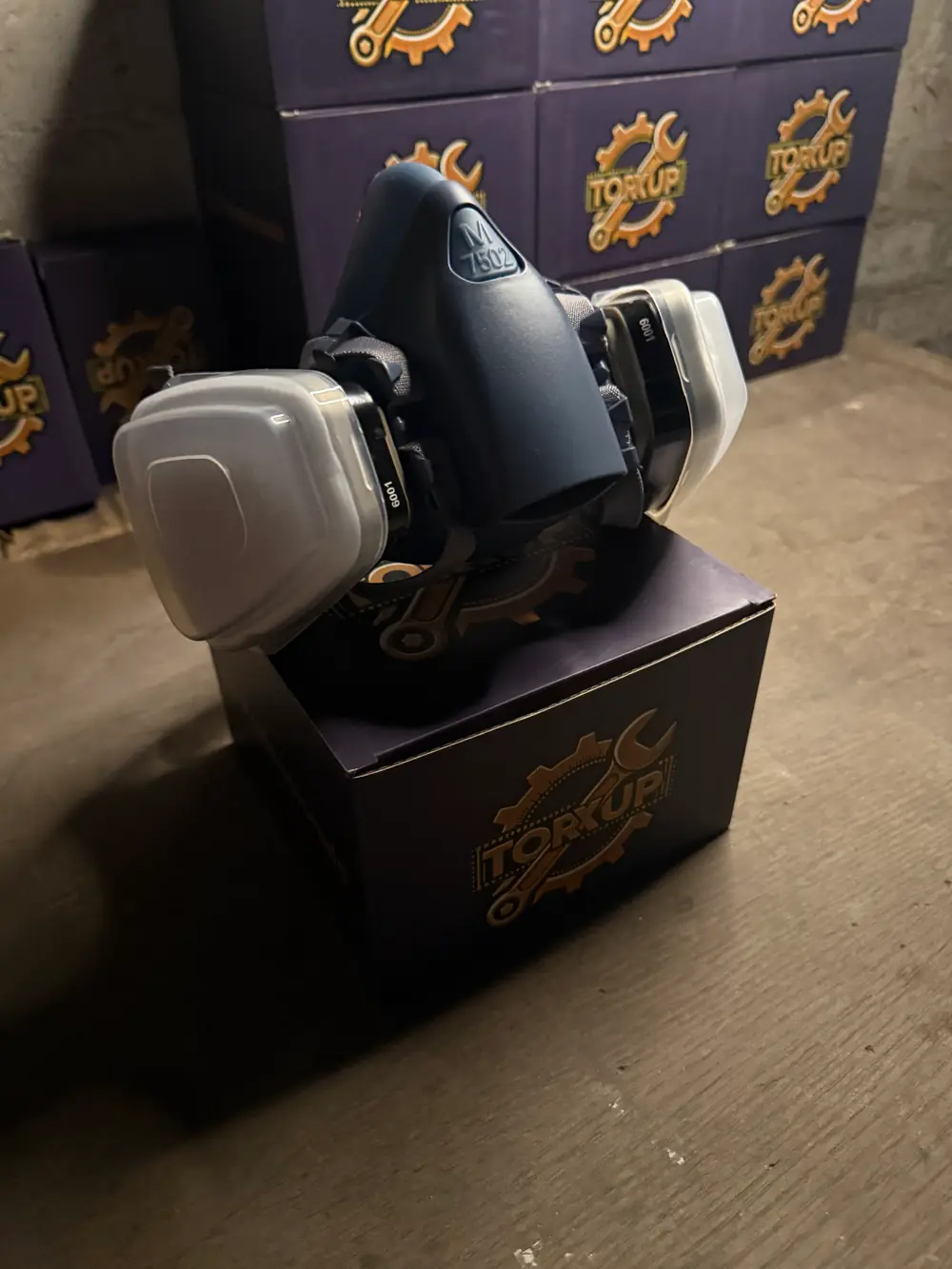 Torxup CoreMask side view on its box in the workshop.